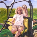 Woman and dog on orchard tractor